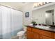 Cozy bathroom with stylish vanity, a toilet, and a shower with a curtain at 5877 N Granite Reef Rd # 2203, Scottsdale, AZ 85250