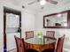 Dining area featuring a round table and a decorative mirror, next to sliding doors that contain the laundry equipment at 5877 N Granite Reef Rd # 2203, Scottsdale, AZ 85250