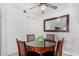 Dining area featuring a round table and seating for four, with a large mirror on the wall at 5877 N Granite Reef Rd # 2203, Scottsdale, AZ 85250