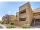 Condominium exterior featuring stucco finish, stairs, and a private balcony with outdoor seating at 5877 N Granite Reef Rd # 2203, Scottsdale, AZ 85250