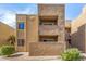 Exterior view of building with balconies and stucco facade at 5877 N Granite Reef Rd # 2203, Scottsdale, AZ 85250