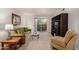 A comfortable sofa, glass coffee table, and large display shelves are the focal point of this living room at 5877 N Granite Reef Rd # 2203, Scottsdale, AZ 85250