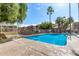 Sparkling community pool surrounded by lush greenery and comfortable lounge chairs at 5877 N Granite Reef Rd # 2203, Scottsdale, AZ 85250