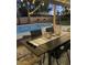 Backyard pool with covered outdoor dining area featuring a lantern centerpiece, seating, and lights at 6621 E Sharon Dr, Scottsdale, AZ 85254