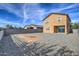 Expansive backyard with gravel landscaping and a block fence, offering privacy and low upkeep at 6815 W Encinas Ln, Phoenix, AZ 85043