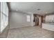 An expansive living room filled with natural light from the large windows at 6815 W Encinas Ln, Phoenix, AZ 85043