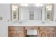 Bathroom featuring double sinks, a white countertop, vanity, and large mirrors with modern lighting at 7061 E Broadway Rd # 48, Mesa, AZ 85208