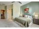 Bedroom featuring neutral carpets, ensuite access, and a tranquil atmosphere at 7321 E Crimson Sky Trl, Scottsdale, AZ 85266