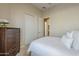 Bright bedroom with double door closet, neutral tones, and ensuite access at 7321 E Crimson Sky Trl, Scottsdale, AZ 85266