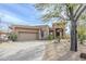 Inviting single story home with mature trees, desert landscaping and a convenient two car garage at 7321 E Crimson Sky Trl, Scottsdale, AZ 85266