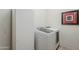 A clean laundry room with front loading washer and dryer at 7321 E Crimson Sky Trl, Scottsdale, AZ 85266