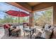 Well-appointed covered patio with comfortable seating and relaxing desert views at 7321 E Crimson Sky Trl, Scottsdale, AZ 85266
