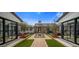 Beautifully landscaped courtyard with outdoor seating, a fountain, and symmetrical design at 7508 E Laredo Ln, Scottsdale, AZ 85250