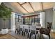 Bright dining room with a large table, modern decor, lots of windows for natural light, and neutral color palette at 7508 E Laredo Ln, Scottsdale, AZ 85250