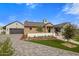 Exterior showcasing a brick home with a circular window and well-maintained landscaping at 7508 E Laredo Ln, Scottsdale, AZ 85250