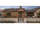 Inviting front entrance showcasing brickwork and a tiled walkway leading to the front door at 7508 E Laredo Ln, Scottsdale, AZ 85250