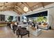 An expansive living room seamlessly connects to the kitchen, with a vaulted ceiling, ample seating, and open-concept design at 7508 E Laredo Ln, Scottsdale, AZ 85250