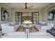Inviting patio with stylish seating, ceiling fan, and a view of the beautifully landscaped courtyard at 7508 E Laredo Ln, Scottsdale, AZ 85250