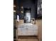 An elegant powder room featuring stylish fixtures and natural light from adjoining room at 7508 E Laredo Ln, Scottsdale, AZ 85250