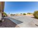 Spacious backyard features a concrete slab, partial gravel cover, and sparse landscaping at 7714 E Calypso Ave, Mesa, AZ 85208