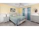 Bedroom featuring painted white wood trim and white nightstands flanking bed with floral cover at 7714 E Calypso Ave, Mesa, AZ 85208