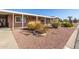 Charming home with desert landscaping and covered carport, creating a welcoming curb appeal at 7714 E Calypso Ave, Mesa, AZ 85208