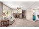 Cozy living room with fireplace, neutral tones, and sliding glass doors for natural light at 7714 E Calypso Ave, Mesa, AZ 85208