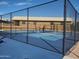 Outdoor pickleball court behind a tall chain link fence perfect for a match at 7714 E Calypso Ave, Mesa, AZ 85208