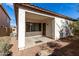 Covered back patio surrounded by minimal landscaping and block fencing at 7739 E Butte St, Mesa, AZ 85207
