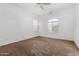 Bright bedroom with neutral carpeting and windows with nice views at 7739 E Butte St, Mesa, AZ 85207
