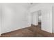 A large empty bedroom with neutral-colored carpet and trim, and lots of natural light at 7739 E Butte St, Mesa, AZ 85207