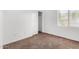 Bedroom with a neutral palette, filled with natural light from a large window at 7739 E Butte St, Mesa, AZ 85207