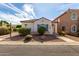 Charming single-story home with a well-maintained front yard and appealing curb appeal at 7739 E Butte St, Mesa, AZ 85207