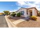 Charming single-story home with desert landscaping, walkway, and tiled roof under a partly cloudy sky at 7739 E Butte St, Mesa, AZ 85207
