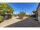 Private backyard space featuring trees and a gravel landscape at 8150 E Mitchell Dr, Scottsdale, AZ 85251