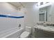 Bright bathroom featuring a gray vanity with granite counters, tile flooring, and a shower-tub combination at 8150 E Mitchell Dr, Scottsdale, AZ 85251