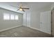 Neutral bedroom with carpet, window shutters, ceiling fan, and closet with sliding doors at 8150 E Mitchell Dr, Scottsdale, AZ 85251
