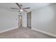Bedroom with neutral walls, carpet flooring, ceiling fan, large closet, and a window with plantation shutters at 8150 E Mitchell Dr, Scottsdale, AZ 85251