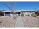 Charming single-story home featuring a well-maintained yard and a welcoming entrance at 8150 E Mitchell Dr, Scottsdale, AZ 85251