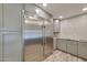 Modern kitchen featuring stainless steel appliances and gray cabinets at 8150 E Mitchell Dr, Scottsdale, AZ 85251