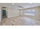 Bright, open living room with tile floors, a ceiling fan, and large windows at 8150 E Mitchell Dr, Scottsdale, AZ 85251
