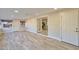 Open-concept living room with tile floor, recessed lights, access to kitchen, and views of the backyard at 8150 E Mitchell Dr, Scottsdale, AZ 85251