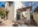 Outdoor patio area with wicker furniture, decorative fire pit, and mature landscaping at 8841 S 48Th St # 1, Phoenix, AZ 85044