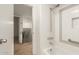 Well-lit bathroom features a shower-tub combo and access to the rest of the home at 8841 S 48Th St # 1, Phoenix, AZ 85044