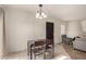 Open dining area with adjacent living space, perfect for entertaining guests at 8841 S 48Th St # 1, Phoenix, AZ 85044