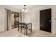 Bright dining room featuring tile floors, neutral paint, and sliding glass door to patio at 8841 S 48Th St # 1, Phoenix, AZ 85044