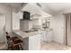 Eat-in kitchen featuring granite countertops, stainless steel appliances, and bar seating at 8841 S 48Th St # 1, Phoenix, AZ 85044