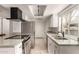 Bright kitchen featuring granite countertops, stainless steel appliances, and modern fixtures at 8841 S 48Th St # 1, Phoenix, AZ 85044