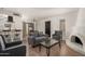 Cozy living room with neutral tones, a decorative fireplace, and comfortable seating arrangement at 8841 S 48Th St # 1, Phoenix, AZ 85044
