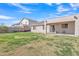 A full view of the backyard showing the covered patio and home's exterior at 9609 E Monte Ave, Mesa, AZ 85209